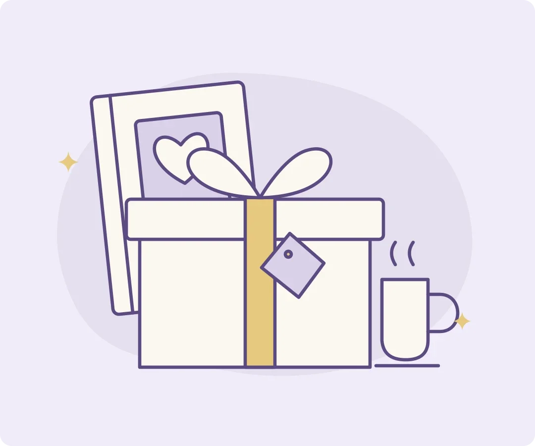 A wrapped birthday gift beside a book and a mug, with a small heart-shaped gift tag.